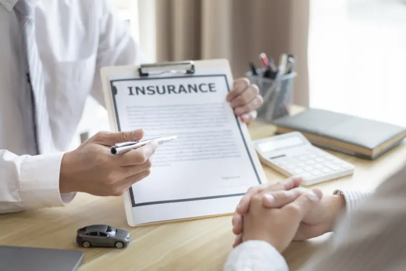 Attorney examining accident photos and medical files to strengthen personal injury claim