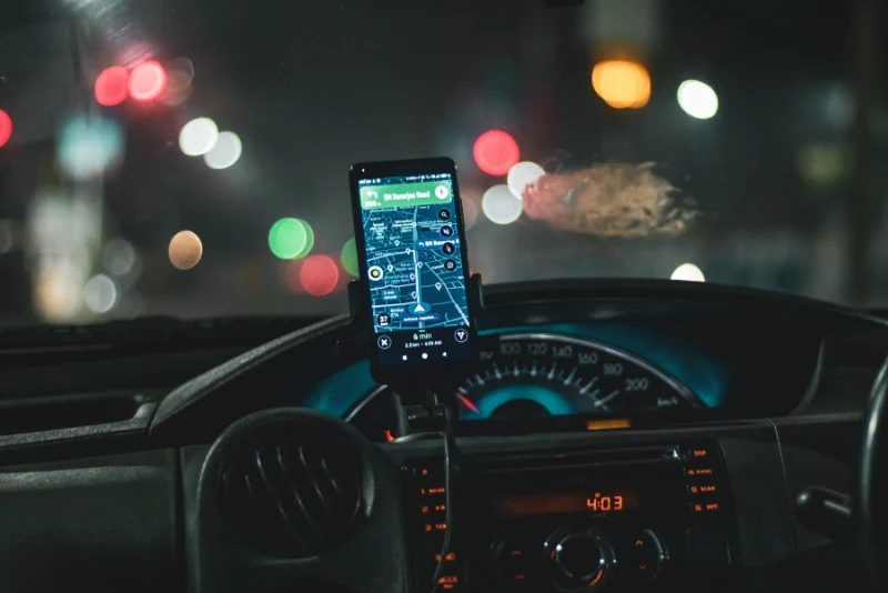 Rideshare passenger reviewing Uber safety features and security measures available during a trip
