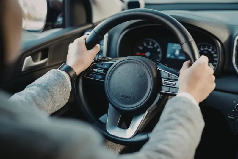 Drivers reviewing accident damages, fault percentages, and insurance claims in California